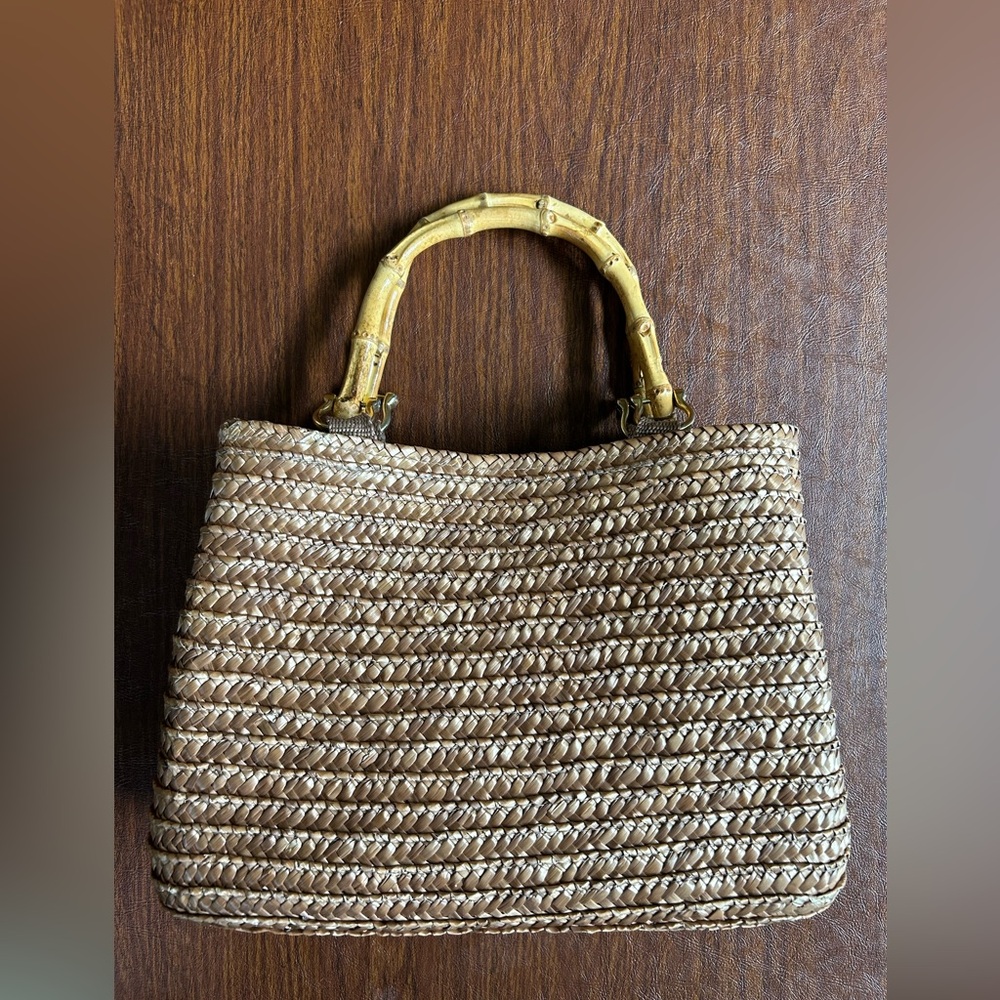 Woven straw handbag with elegant bamboo handles by St. John’s Bay
